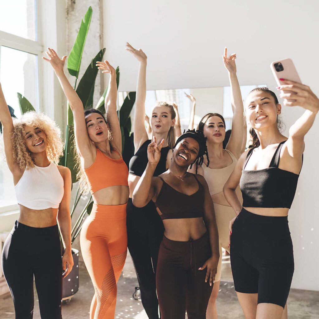 group-of-multiracial-friends-taking-selfie-at-gym-PP9Y4KA.jpg